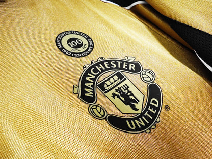 The 2001/02 Manchester United Reversible golden / white