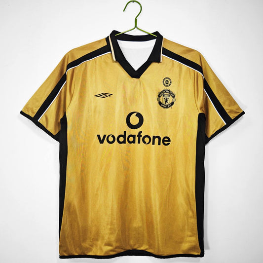 The 2001/02 Manchester United Reversible golden / white